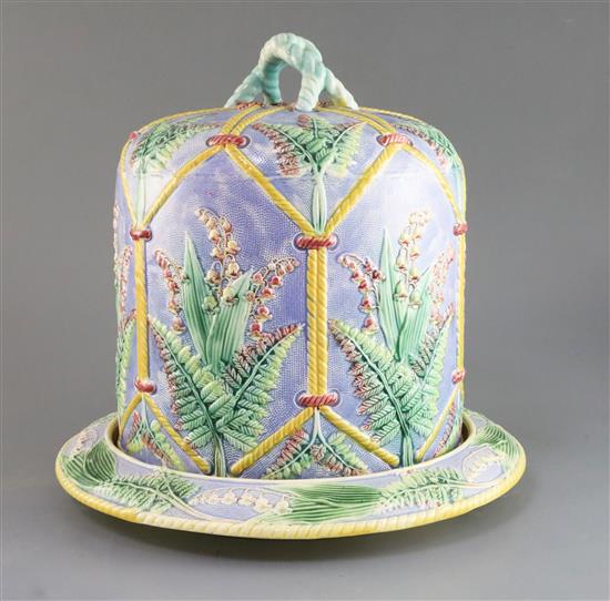 A Victorian majolica cheese dome and stand, H. 12.25in., faults